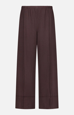 The THEORY Pintuck Pull-On Pant is a wide-leg, high-waisted brown pant crafted from silky smooth fabric, featuring an elastic waistband and a relaxed, pull-on design, shown against a plain white background.