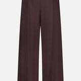 The THEORY Pintuck Pull-On Pant is a wide-leg brown pant crafted from silky smooth fabric, featuring an elastic waistband and a comfortable pull-on design with a straight, loose fit, displayed against a plain white background.