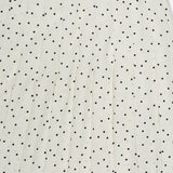 The THEORY Pleated Polka Dot Wrap Skirt features vertical pleats that enhance the textured look of its classic white fabric with black polka dots.