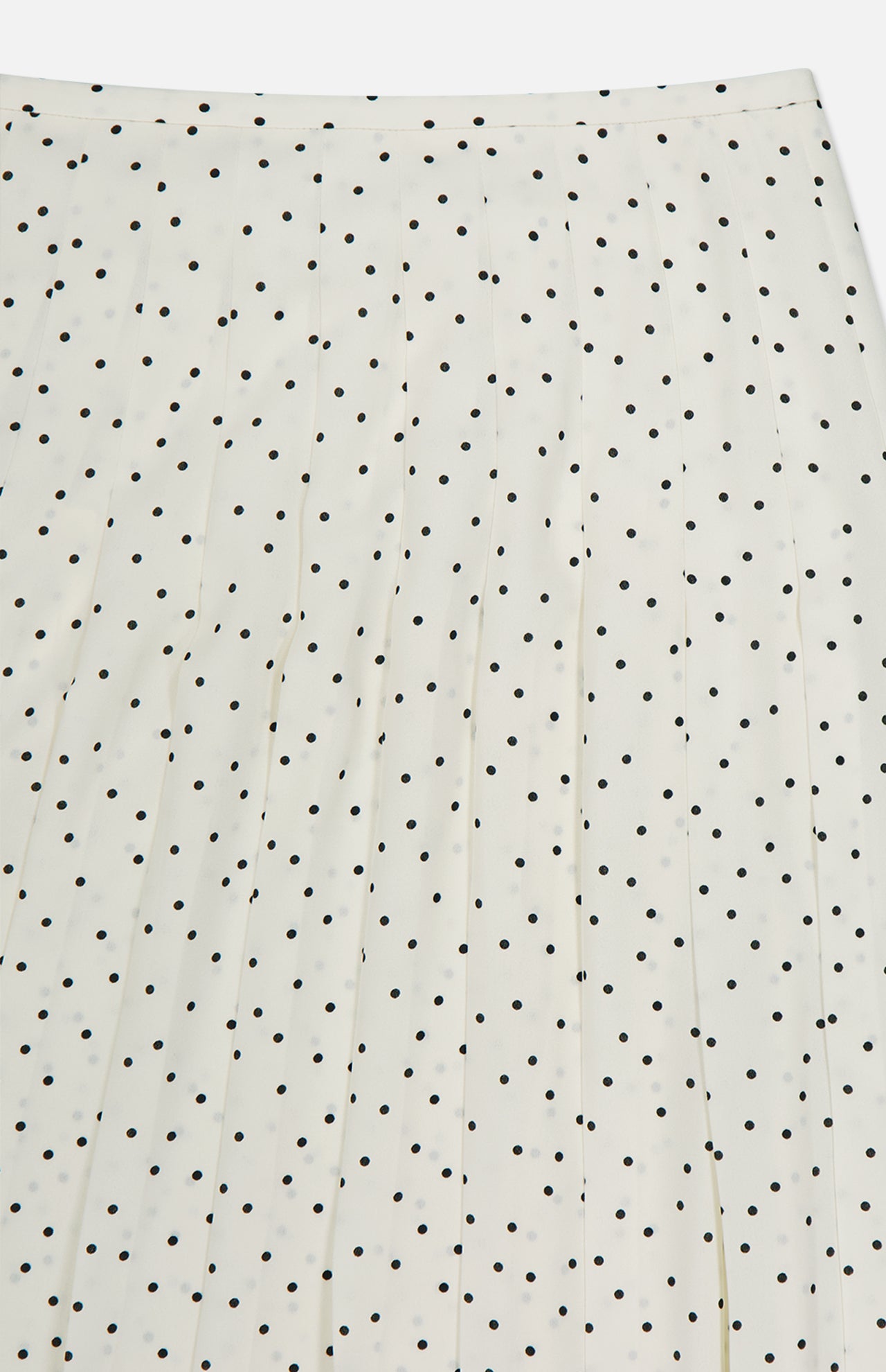 The THEORY Pleated Polka Dot Wrap Skirt features vertical pleats that enhance the textured look of its classic white fabric with black polka dots.