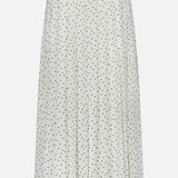 The THEORY Pleated Polka Dot Wrap Skirt features a white high-waist design with black polka dots and soft pleats for a flowy, elegant look—ideal for the office or stylish daily wear.