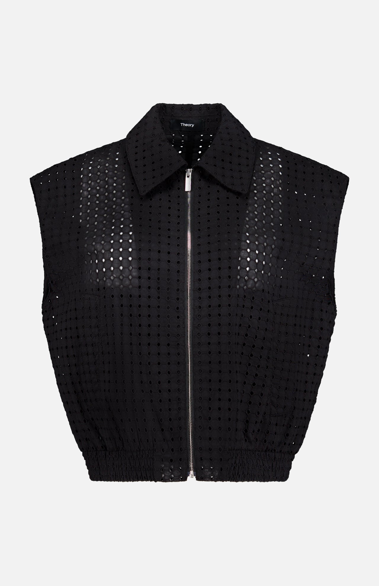 THEORY Eyelet Zip Vest—a sleeveless, collared black top made from perforated grid-patterned fabric—shown on a plain white background for a bold statement look.