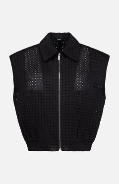 THEORY Eyelet Zip Vest—a sleeveless, collared black top made from perforated grid-patterned fabric—shown on a plain white background for a bold statement look.