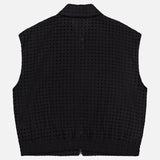 The THEORY Eyelet Zip Vest is a black sleeveless top with a textured grid pattern, collar, and elastic hem band, shown flat on a white background.