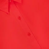 Close-up of the THEORY Sleeveless Cropped Elastic Shirt in red, ideal for office wear, featuring four buttons, part of the collar, and a partial black label with white text displaying size 6 at the top left.