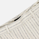 Close-up of the waistband on the THEORY Slim Full Length Trouser Pant in light beige crepe with thin navy pinstripes, belt loop, and partial seam, shown against a plain white background.