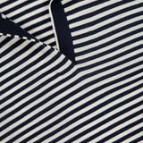 Close-up of the Stripe Boy Long Sleeve Shirt by THEORY, featuring navy stripes, white accents, and a V-shaped neckline. The THEORY label is visible near the collar, highlighting this stylish nautical summer top.