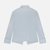 The THEORY Tailored Cutaway Shirt is displayed from the back in light blue, showcasing its long sleeves, slim-fit silhouette, classic collar, buttoned cuffs, and a straight cutaway hem with side slits. This versatile office dress shirt is presented against a plain white background.