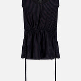 The THEORY Tie Easy Stripe Tank Top features a sleeveless black design with white vertical pinstripes, a V-neckline, adjustable drawstring waist, and flared hem—ideal for coordinated looks or pairing with matching work sets. Shown on a light background.