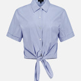 The THEORY Tie Front Striped Short Sleeve Blouse features a light blue color with white vertical stripes, a collared neckline, short sleeves, and a button-up front with a stylish tie at the waist. Displayed against a plain white background.