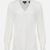 The THEORY Volume Sleeve Silk Blouse features an off-white hue, voluminous pleated sleeves with cuffed wrists, a V-neckline, and a relaxed fit, shown against a plain white background.