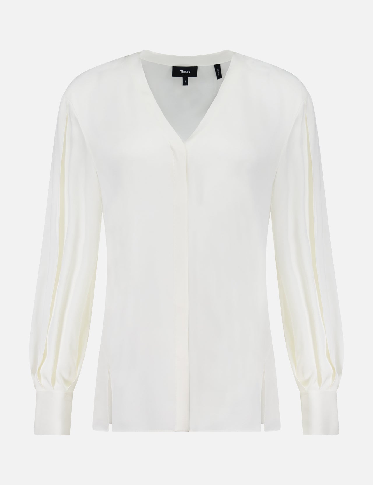 The THEORY Volume Sleeve Silk Blouse features an off-white hue, voluminous pleated sleeves with cuffed wrists, a V-neckline, and a relaxed fit, shown against a plain white background.
