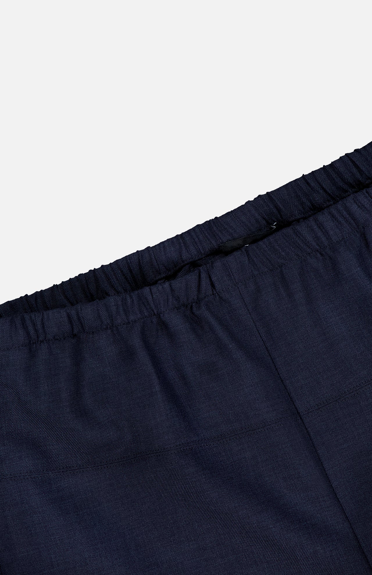 Close-up of the waistband on THEORY’s Wide Cropped Pull-On Pant in dark navy, featuring an elastic band and pull-on design, displayed against a plain white background.