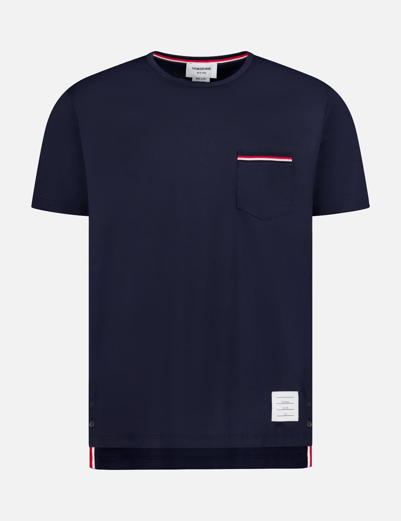 The THOM BROWNE Jersey Cotton Short Sleeve Pocket T-shirt features navy blue 100% cotton, a chest pocket with red and white trim, short sleeves, and a white rectangular label by the hem for effortless comfort and style.