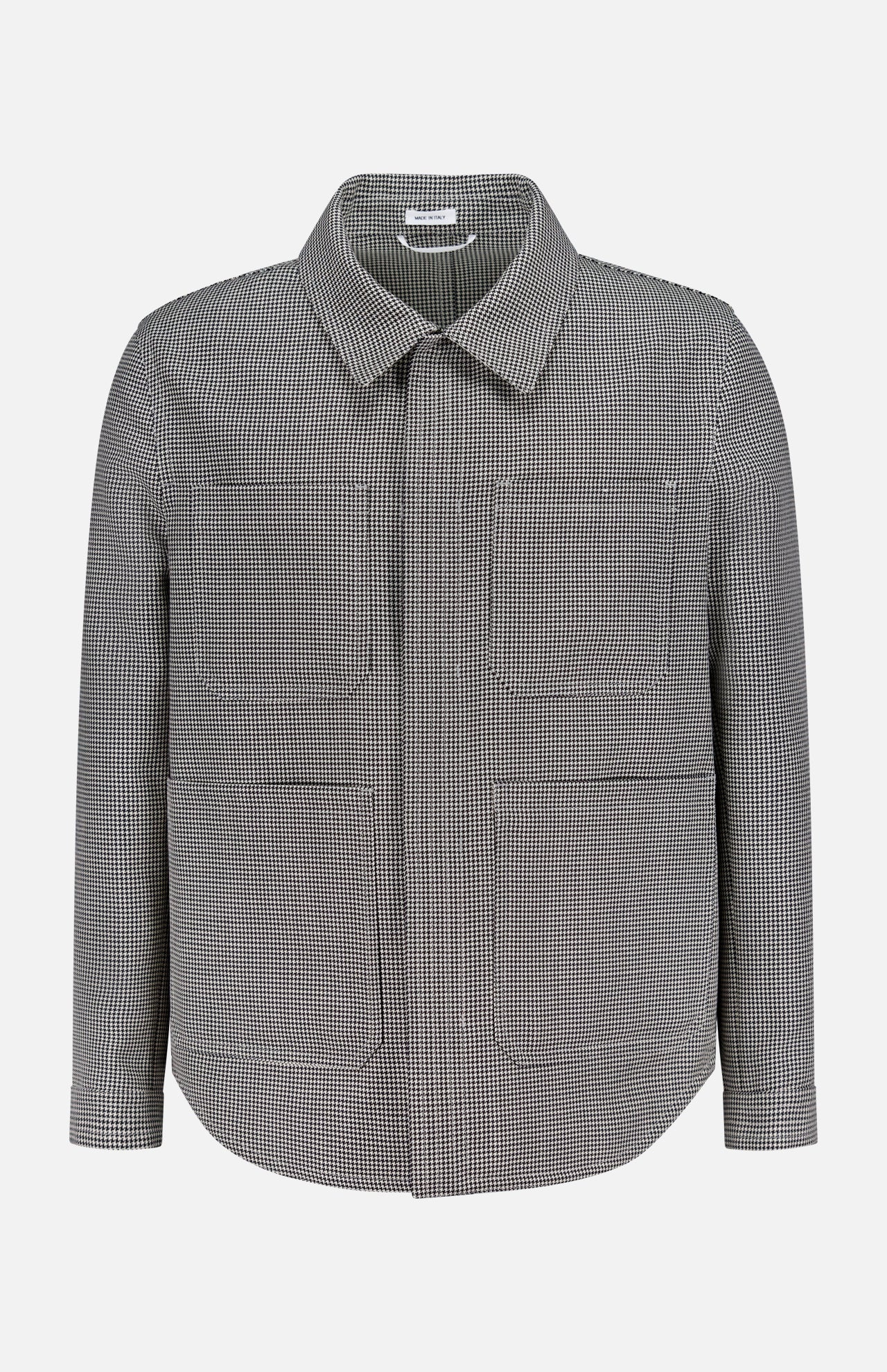 The THOM BROWNE Houndstooth Utility Patch Pocket Jacket features a black and white houndstooth pattern, a collared neckline, concealed front zipper with placket, and two large front pockets, shown on a white background.