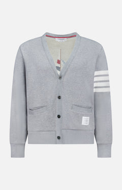 The THOM BROWNE Stitched Boat Graphic Cardigan features a light grey V-neck design, two front pockets, a white hem label, four white stripes on one sleeve, and adds coastal charm to any look.
