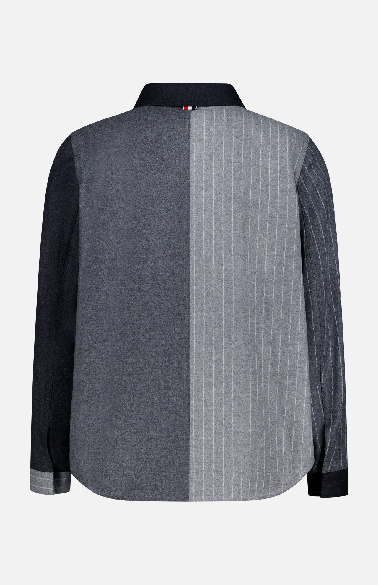 The Funmix Stripe Utility Patch Pocket Jacket by THOM BROWNE features a long-sleeve button-up design with a divided back: one side in solid dark gray, the other in light gray adorned with thin white pinstripes. Inspired by classic American menswear, this contemporary piece showcases a dark collar and left sleeve, while the right sleeve mirrors the pinstriped pattern for a bold, distinctive look.