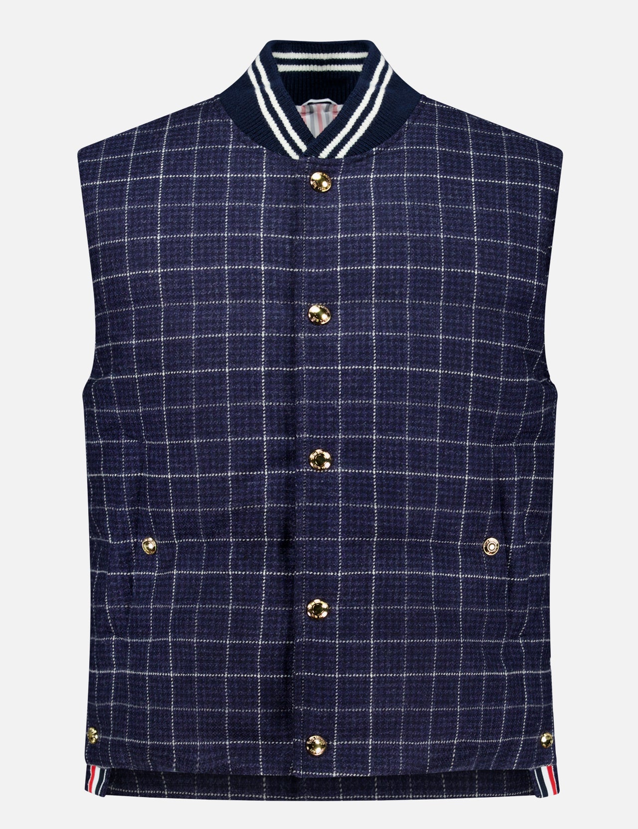 Channeling classic American sensibility, the Houndstooth Teviot Tweed Snap Front Vest by THOM BROWNE features a sleeveless navy blue houndstooth tweed design with gold snaps, two front pockets, and a ribbed collar and hem detailed with white and navy stripes.