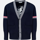 The THOM BROWNE Jersey Stitch Lobster Cardigan is a men's navy V-neck cotton cardigan with white and red striped sleeve accents, Americana-inspired striped collar and placket, two front pockets, and a partially visible lobster graphic inside.