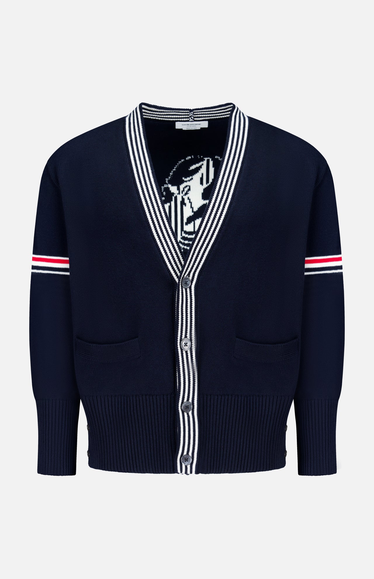 The THOM BROWNE Jersey Stitch Lobster Cardigan is a men's navy V-neck cotton cardigan with white and red striped sleeve accents, Americana-inspired striped collar and placket, two front pockets, and a partially visible lobster graphic inside.