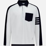 Crafted by THOM BROWNE, the Oversized Long Sleeve Colorblock Rugby Polo Shirt showcases a bold white base, accented with a contrasting black collar, distinctive black pocket, and four horizontal black stripes on the left sleeve. Black panels trace the shoulders and sleeves, lending contemporary contrast to this updated sporty essential.
