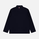 An Oversized Long Sleeve Colorblock Rugby Polo Shirt by THOM BROWNE, shown from the back in dark navy, features a signature small red, white, and blue striped tag below the collar—evoking classic colorblock design elements—set against a plain light gray background.