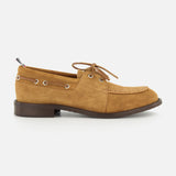 The THOM BROWNE Padded Boat Suede Loafer is a tan men's slip-on with brown laces, metal eyelets, and a low dark brown heel, shown in side profile on a white background.