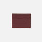The THOM BROWNE Pebble Grain Leather Card Holder in burgundy features four horizontal card slots and is crafted from luxurious pebble grain leather, shown against a plain white background.