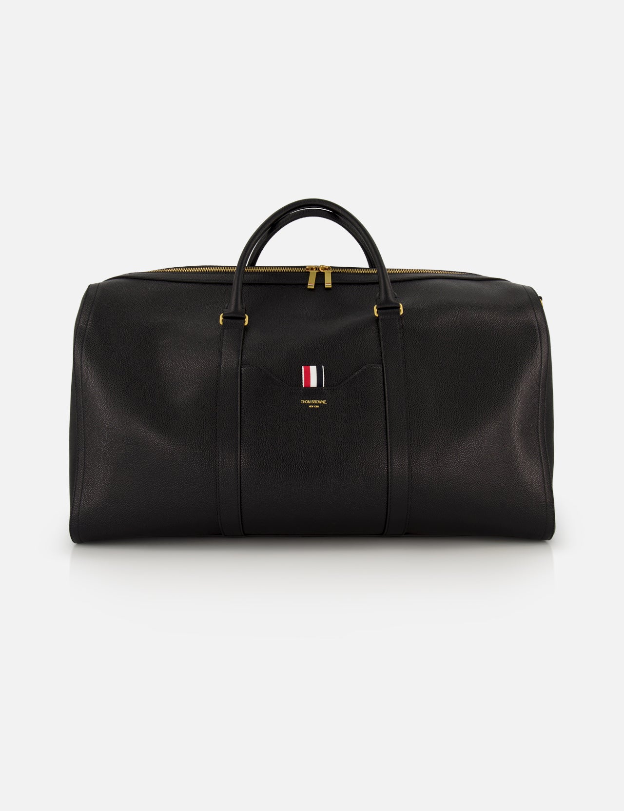 The THOM BROWNE Pebble Grain Leather Duffle Bag features black leather, gold zippers and hardware, two handles, and a front logo with red, white, and blue stripes—a stylish and convenient travel essential.