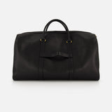 The THOM BROWNE Pebble Grain Leather Duffle Bag, featuring two handles, gold-tone hardware, and a minimalist black design, is displayed against a plain white background.