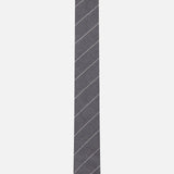 The THOM BROWNE Pinstripe Wool Classic Tie, crafted in Italy from fine wool, features thin diagonal white stripes on a grey background and is displayed against a plain white backdrop.