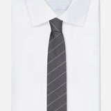 A white dress shirt is neatly folded with the THOM BROWNE Pinstripe Wool Classic Tie laid on top, set against a plain background.