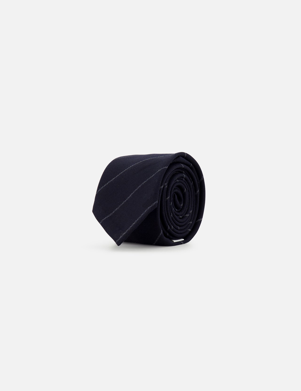 A rolled-up Pinstripe Wool Classic Tie by THOM BROWNE, featuring subtle diagonal stripes in black wool and crafted in Italy, is displayed on a plain light gray background.