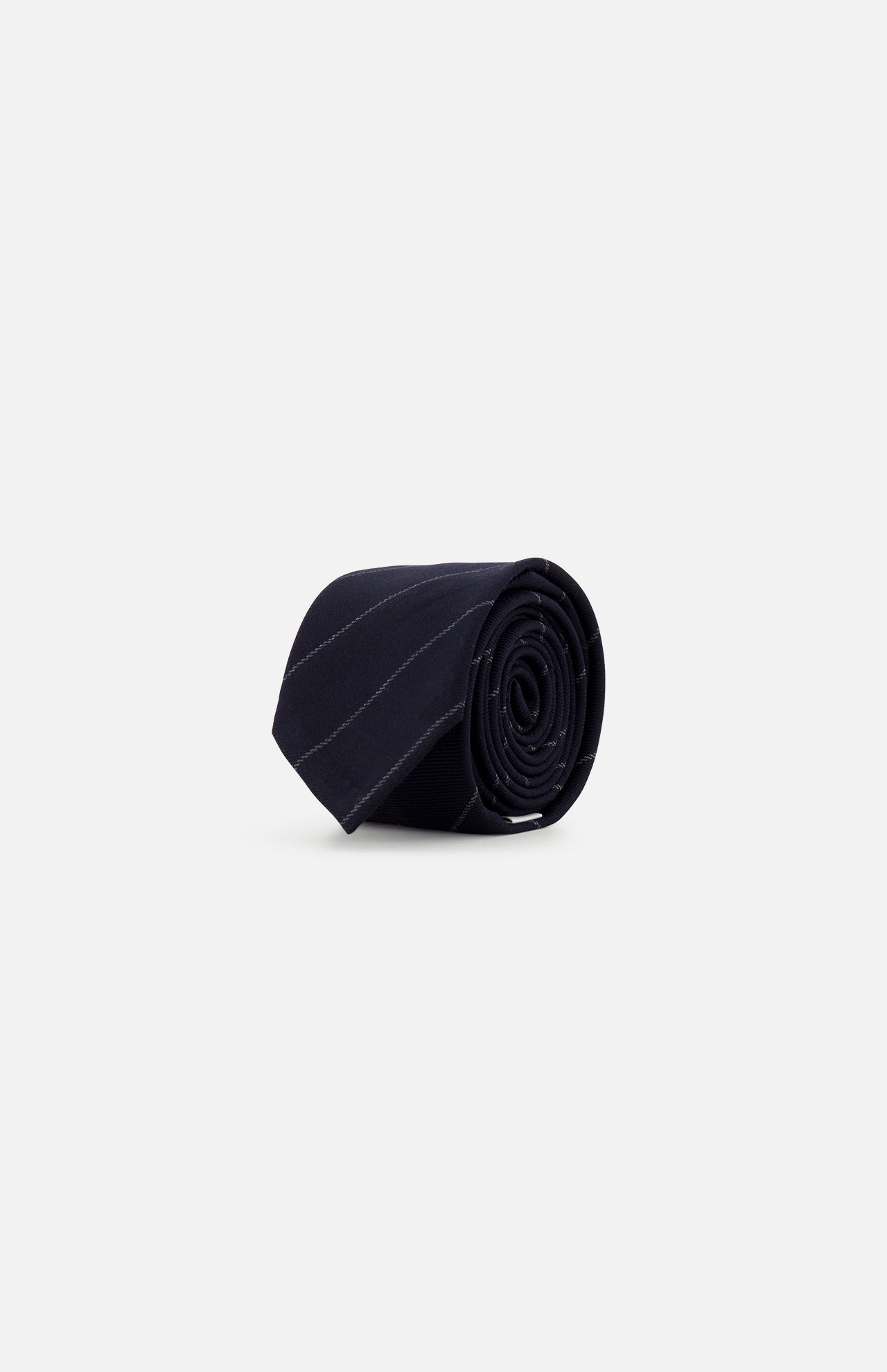 A rolled-up Pinstripe Wool Classic Tie by THOM BROWNE, featuring subtle diagonal stripes in black wool and crafted in Italy, is displayed on a plain light gray background.