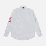 A white, long-sleeve button-up oxford shirt by THOM BROWNE, the Straight Fit Lobsters Long Sleeve Oxford Shirt features subtle light blue pinstripes and is shown from the back. Red and white accents on the right sleeve and a small striped fabric tab near the collar lend an understated Americana touch to this classic dress shirt.