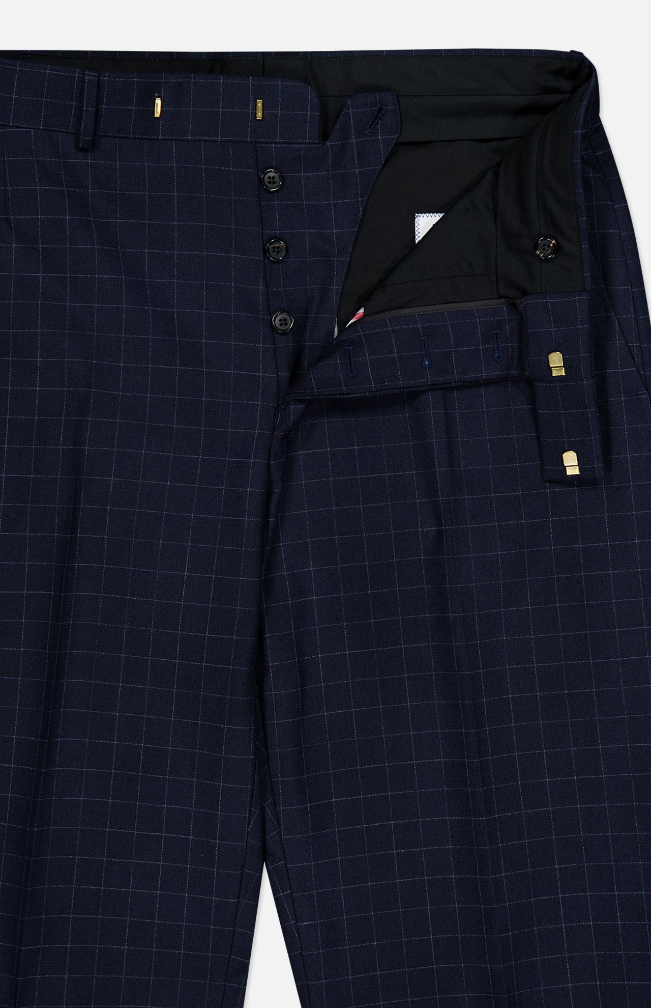THOM BROWNE Windowpane Check Cotton Wool Trouser Pant in navy, featuring a white windowpane pattern, shown partially unbuttoned to reveal the button fly and cotton wool inner waistband.