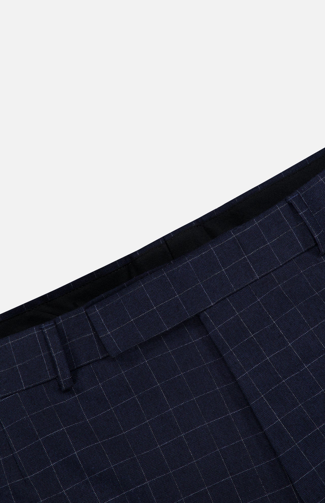 Close-up of the waistband of the THOM BROWNE Windowpane Check Cotton Wool Trouser Pant, featuring a light blue check pattern, belt loops, and pleats against a plain background.