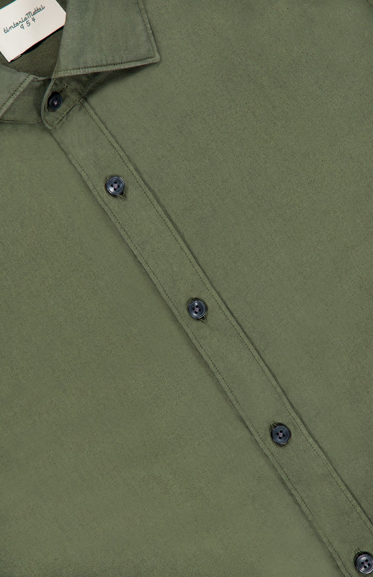 Close-up of the TINTORIA MATTEI Cotton Long Sleeve Dress Shirt in olive green, highlighting the collar, black buttons, and a portion of the label inside the collar.