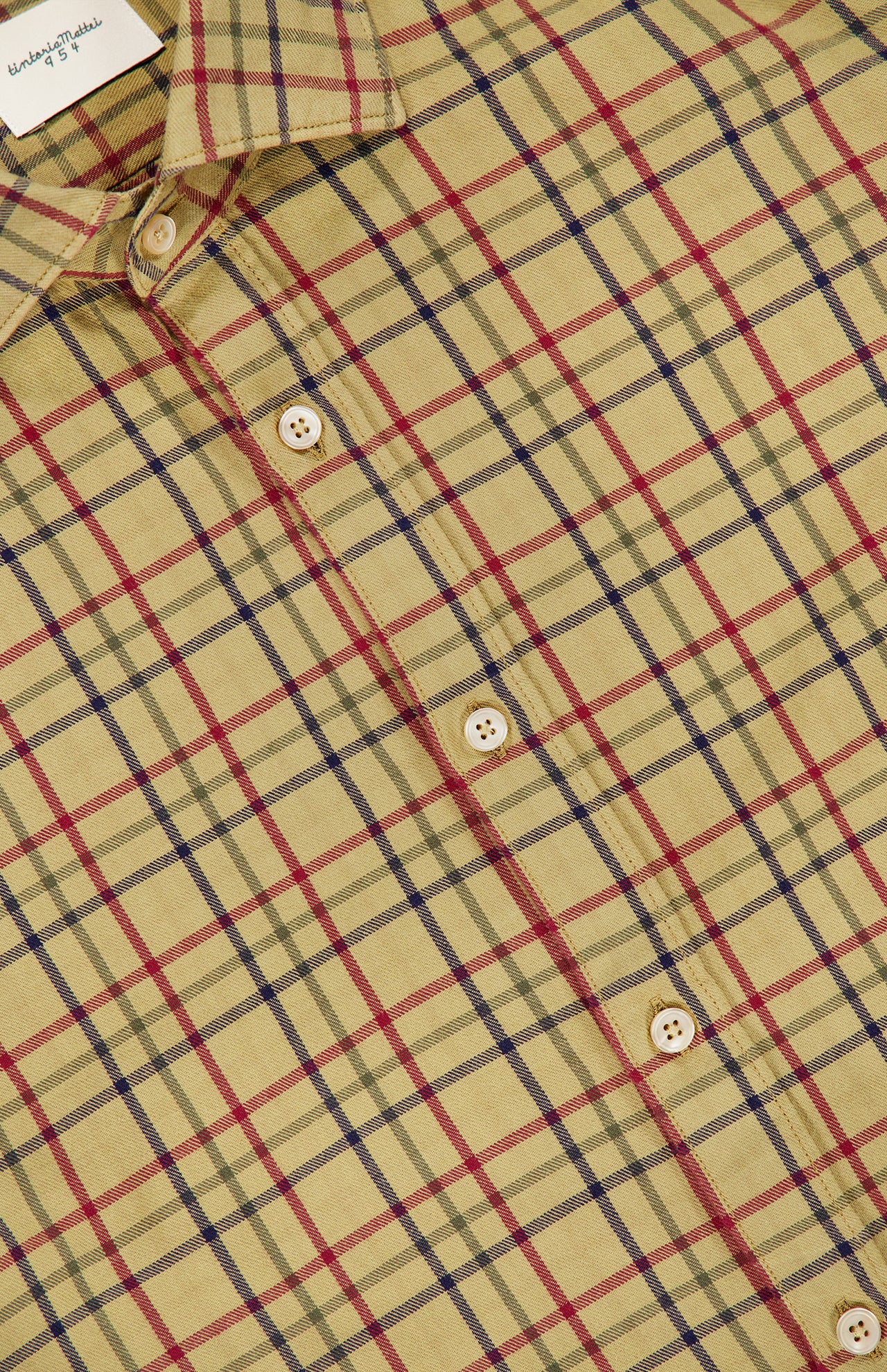 A close-up of the TINTORIA MATTEI Cotton Plaid Dress Shirt for men in beige, featuring a classic red, black, and white plaid pattern. The image highlights the collar and multiple buttons on this timeless long sleeve shirt.