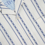 Close-up of the TINTORIA MATTEI Cotton Stretch Short Sleeve Shirt, featuring blue vertical stripes and diamond patterns, a button-down collar, chest pocket, and a visible label at the neckline.