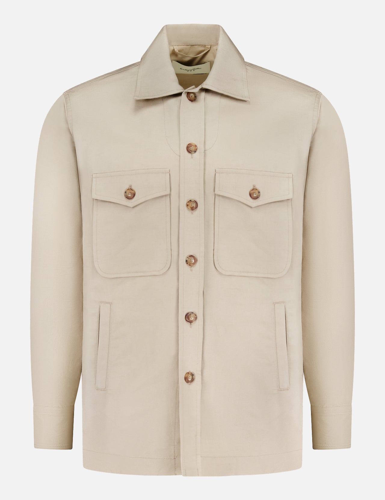 The TINTORIA MATTEI Linen and Cotton Overshirt in stone features a button-up front, pointed collar, two chest flap pockets with buttons, and two vertical side pockets, shown on a plain white background.