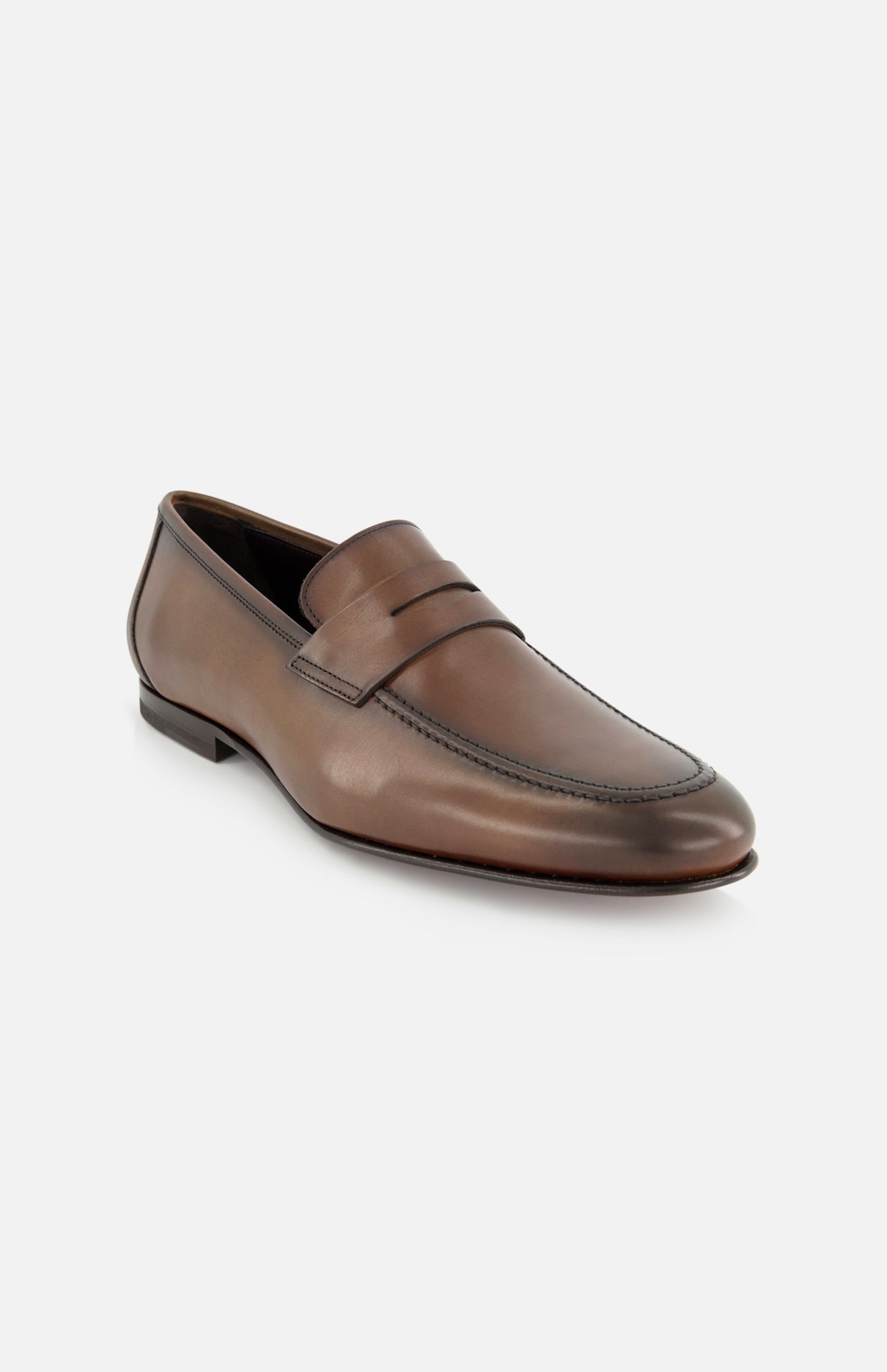 The TO BOOT Aldrin Leather Penny Loafer, a brown men’s shoe with a classic penny strap, visible toe stitching, and a low heel, is shown against a plain white background.