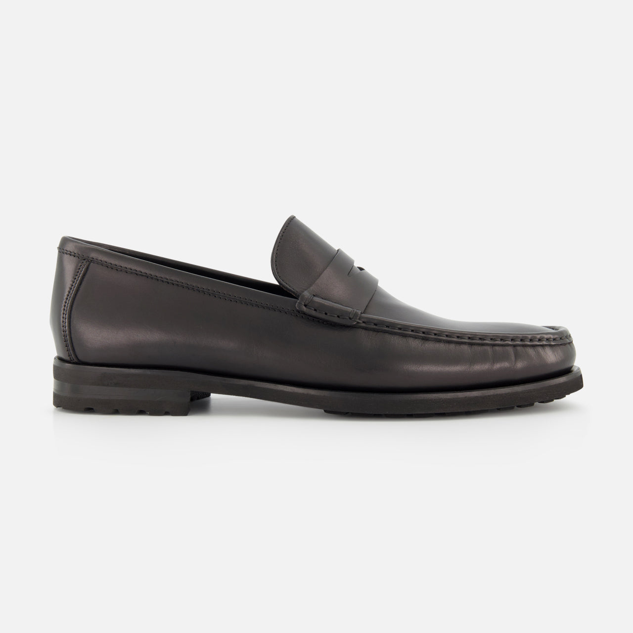 The TO BOOT Belfast Leather Loafer, a single black shoe with a low heel and moccasin-style toe, made in Italy, is shown in profile against a plain white background.