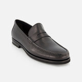 The TO BOOT Belfast Leather Loafer is a black slip-on with sleek design, visible toe stitching, and a low heel, shown on a plain white background.