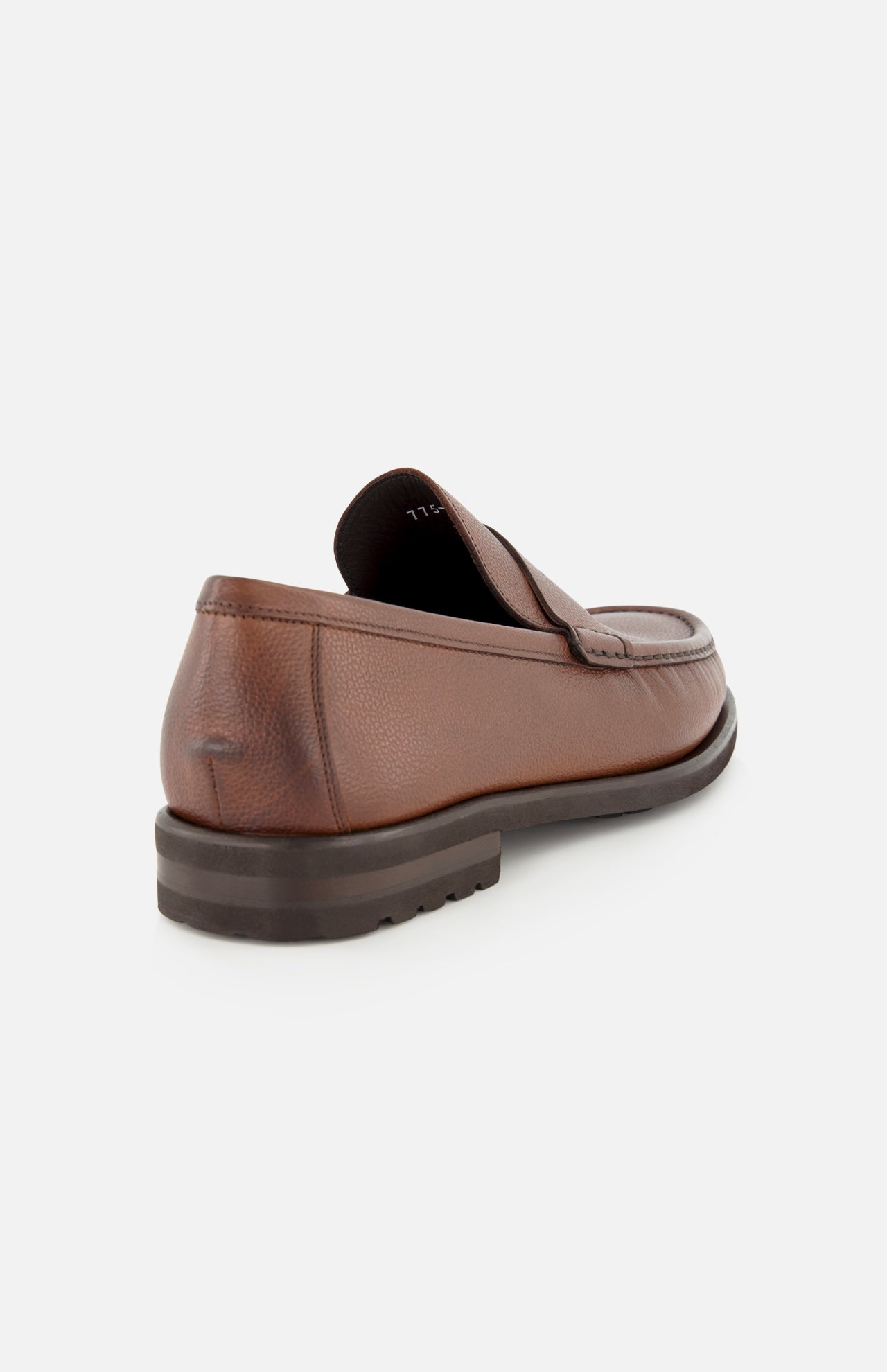 The Fischer Penny Leather Loafer by TO BOOT is pictured from the back, showcasing its rich brown textured leather, low heel, and timeless slip-on design. Crafted in Italy, this loafer features a dark brown sole and is displayed against a plain white background.