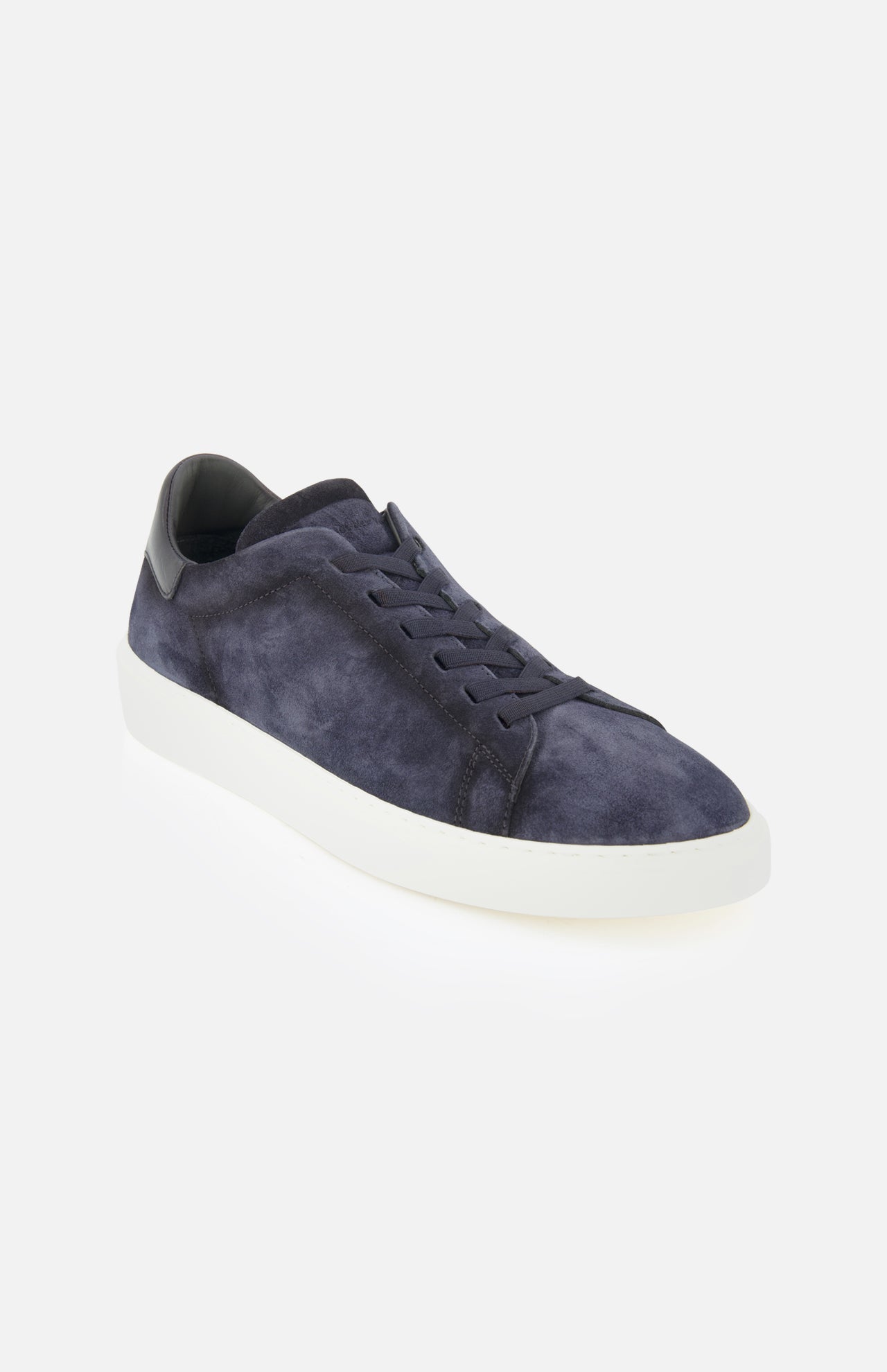 TO BOOT James Slip On Sneaker in navy blue suede, featuring a white rubber sole and black heel accent, made in Italy and shown against a plain white background.