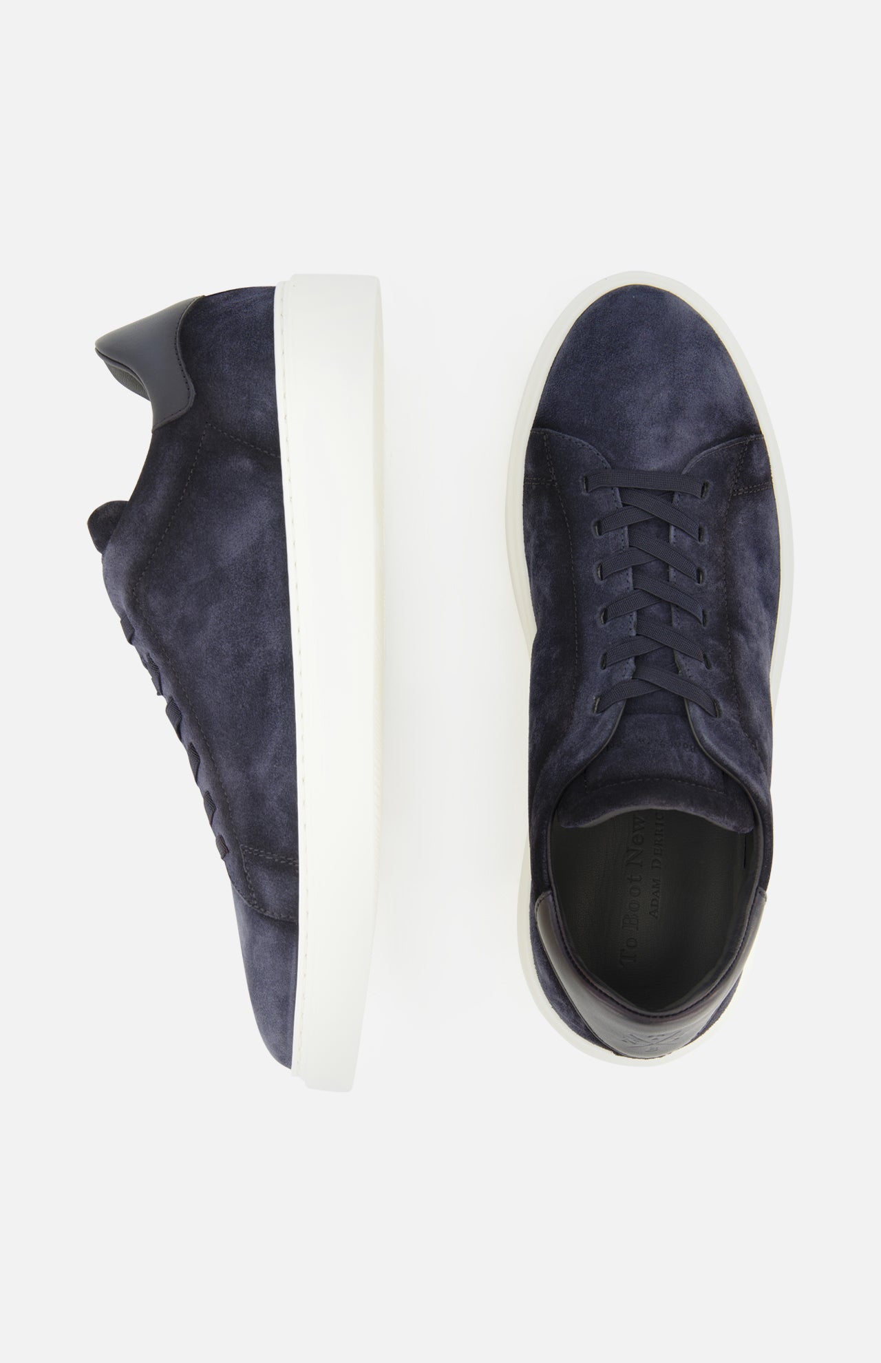 A pair of James Slip On Sneakers by TO BOOT in navy suede with white soles, made in Italy, displayed from side and top views on a white background.