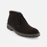 The Javier Suede Chukka Boot by TO BOOT is a single men’s designer boot in black, expertly crafted from premium suede with black laces, distinctive visible stitching along the sole, and a rugged rubber outsole—presented against a white background.