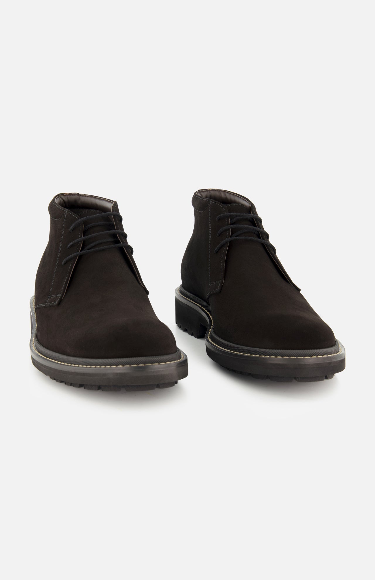 The TO BOOT Javier Suede Chukka Boot is a pair of men’s designer black suede chukka boots, featuring black laces and thick rubber soles, displayed on a plain white background.