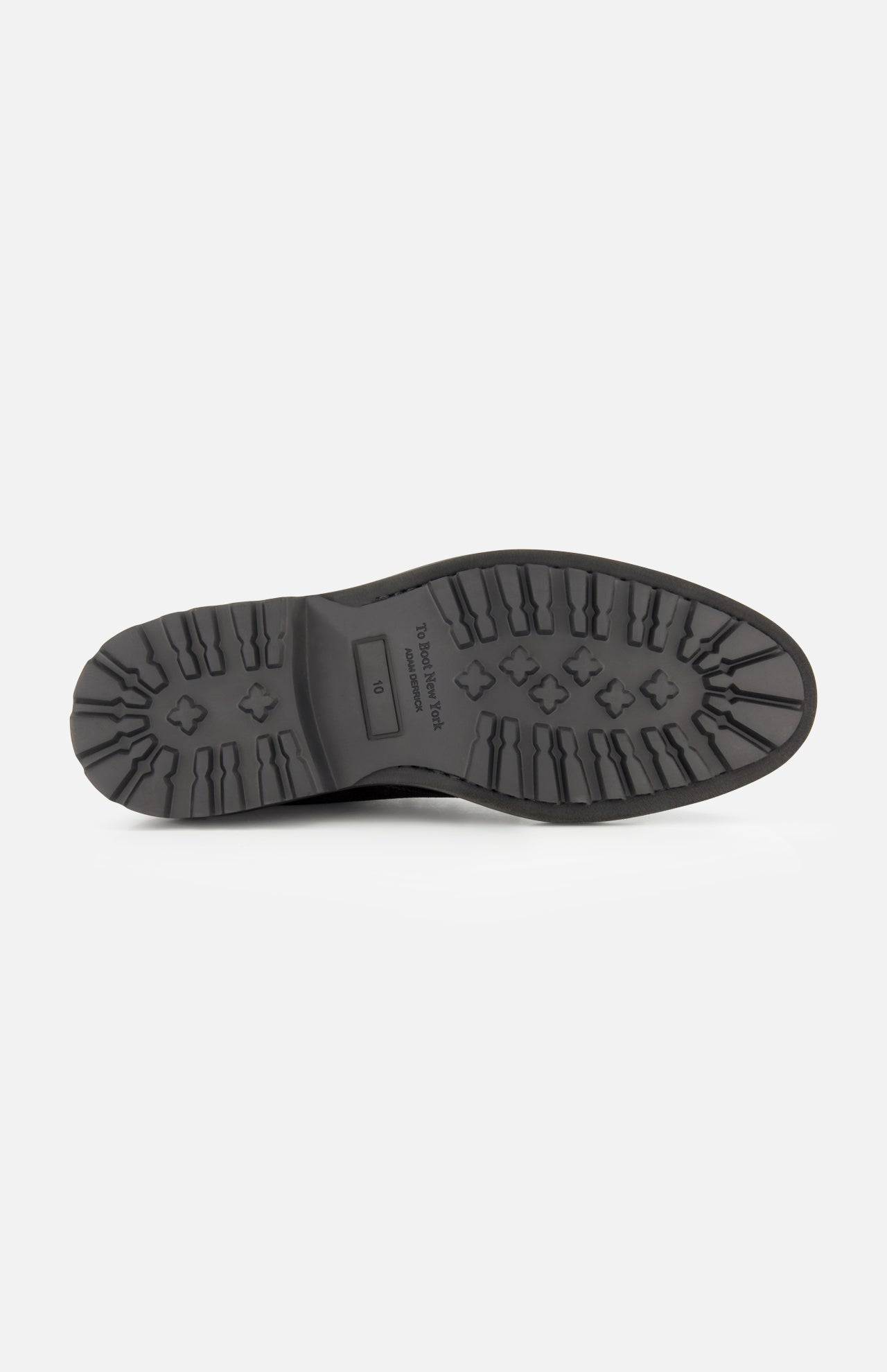 The image displays the black rubber sole of the TO BOOT Javier Suede Chukka Boot for men, seen from below, featuring a rugged tread pattern for traction and a size marking in the center.